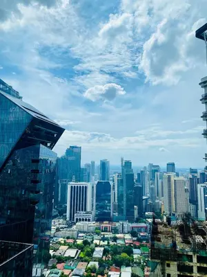 a view of a city with tall buildings at Poblacion Makati with Pool, Gym, Jacuzzi, Pool Table and fast wifi in Manila