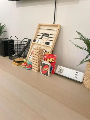 a shelf with some food and toys on a table at Venice McKinley Stay with Pool, Gym, fast Wifi and Netflix in Manila