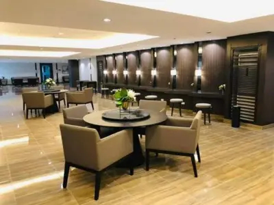 a dining room with a table and chairs at Makati Staycation by Jing in Manila