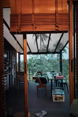 a room with a table and chairs and a room with a view at Gamay Payag Tagaytay in Calamba
