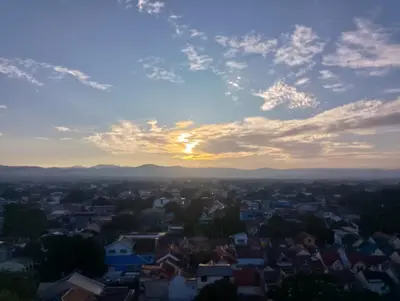 a view of a city at sunset at 1 Bedroom Apartment with Mountain View and WiFi in Manila