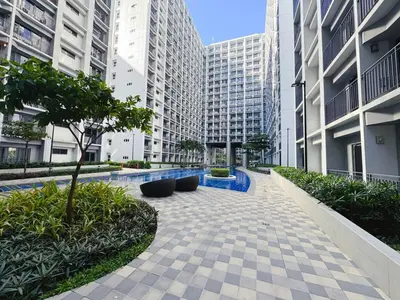 a courtyard in a city with tall buildings at City View Shore2 Residence Tower1 in Manila