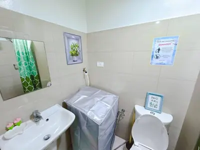 a small bathroom with a sink and a toilet at City View Shore2 Residence Tower1 in Manila
