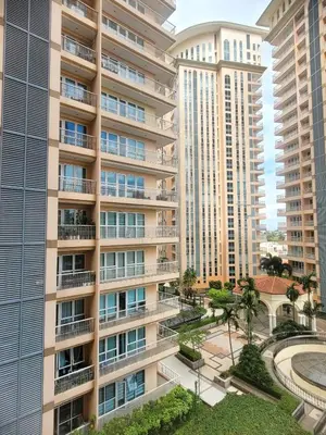 an aerial view of a building with tall buildings at Urban Studio with Balcony in Manila