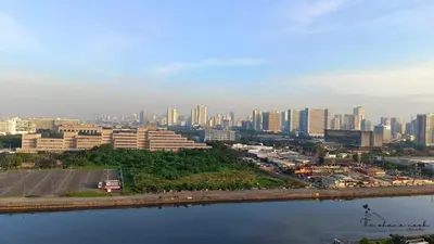 a view of a city with a river and buildings at The Hearth Bliss in Manila