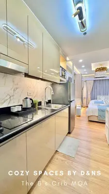 a kitchen with a sink and a bed in a room at SM MOA Near NAIA Airports The B's Crib MOA in Manila