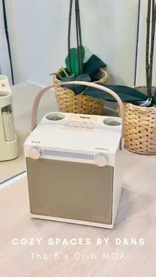 a toaster sitting on top of a table with plants at SM MOA Near NAIA Airports The B's Crib MOA in Manila