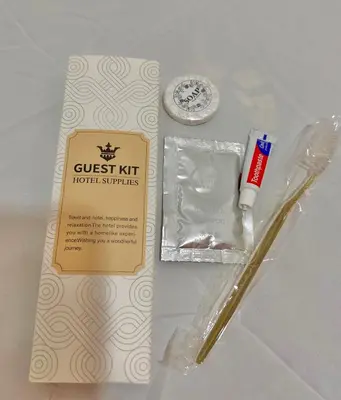 a box of guest kit with a toothbrush and toothpaste at PPL Homestay