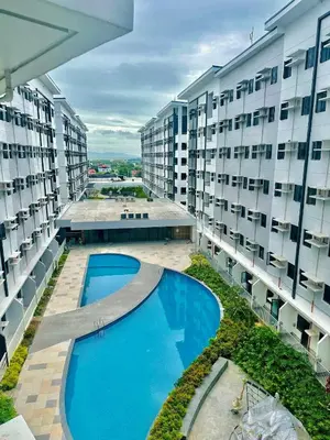 an overhead view of an apartment building with a swimming pool at Golden Maison de Luxe in Manila