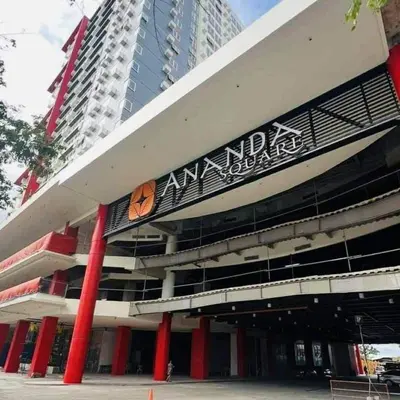 a building with a sign on the side of it at NestAway Condo in Manila