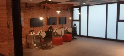 a room with a brick wall with windows and chairs at Modern Cozy Studio in Makati City with Free Pool, Sauna and Gym in Manila