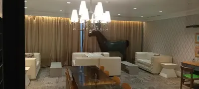 a dining room with a table and a horse statue at Modern Cozy Studio in Makati City with Free Pool, Sauna and Gym in Manila