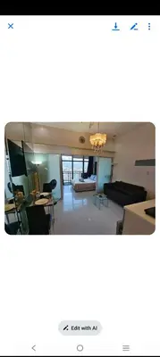 a view of a living room with a couch and a table at STUDIO Type CONDO in Manila