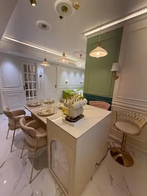 a kitchen with a table and chairs in a room at Azure 2BR Beach View Suite- Bathtub, Smart Toilet, Netflix in Manila