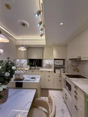 a large kitchen with white cabinets and a counter top at Azure 2BR Beach View Suite- Bathtub, Smart Toilet, Netflix in Manila