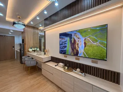 a bathroom with a large television on the wall at Hotel-like flat at Bay City Haven Mall of Asia SMX in Manila