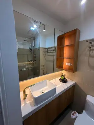 a bathroom with a sink and a shower at Hotel-like flat at Bay City Haven Mall of Asia SMX in Manila