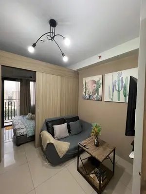 a living room with a couch and a bed at Shore 2 Residences, Tower 1 in Manila
