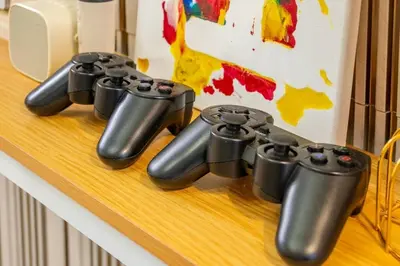 a group of video game controllers sitting on a counter at 1BR Near MOA Balcony & Wi-Fi in Manila