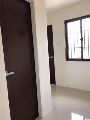 a room with a wooden door and a window at Wilabdaman manila in Manila