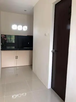 an empty room with a door and a window at Wilabdaman manila in Manila