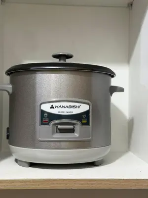 a slow cooker sitting on a shelf in a kitchen at Nordic Style 1br Shore 2 Residences Tower 3 in Manila
