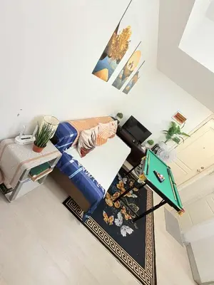 an overhead view of a room with a bed and a table at Azure Destiny's Suites 1912 in Manila