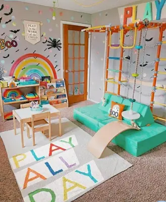 a childrens room with a green couch and a rainbow at MOA Condo Stay with balcony Pool View 2 Beds in Manila