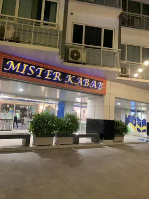 a misler kazabs store with a sign on it at MOA Condo Stay with balcony Pool View 2 Beds in Manila