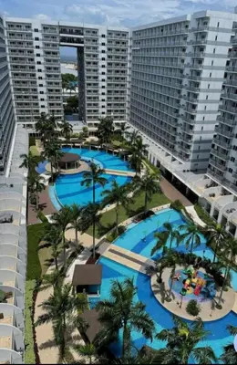 an aerial view of a resort with several pools at MOA Condo Stay with balcony Pool View 2 Beds in Manila