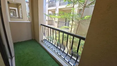 a balcony of a building with a green floor at 924 Villa Tropez Tower in Manila
