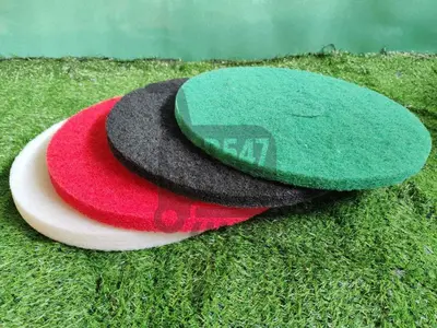 two hats sitting on top of the grass at Jaustine's Cabin in Manila