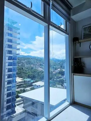 a large window with a view of a city at MANILA AIR RESIDENCE 24 floor in Manila