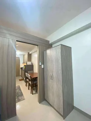 a living room with a room with a dining room at Staycation Marcos Residence in Manila