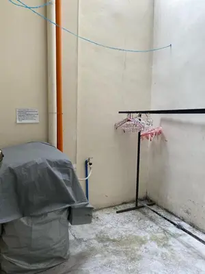 a room with a table next to a wall at 1BR Cozy Townhouse - AC in room only in General Trias