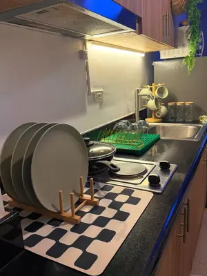 a kitchen with a sink and a counter top at Euphoria Suites Shore 2 Tower 1 Residences in Manila