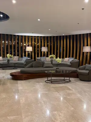 a large living room with couches and a table at Euphoria Suites Shore 2 Tower 1 Residences in Manila