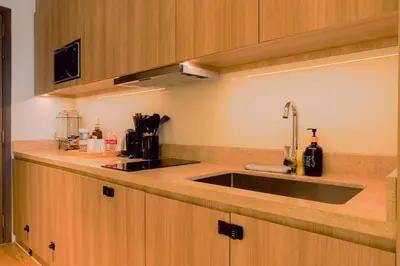 a kitchen with a sink and a counter top at Primo Espacio at Hotel Residences Acqua in Manila