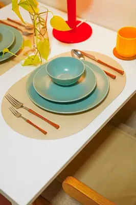 a table with plates and utensils on a table at Airhaus Studio in Manila