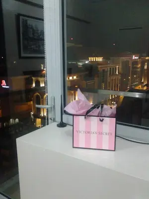 a pink shopping bag sitting on top of a counter at One Palm Tree Villa CC9N in Manila