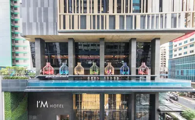 a building with a bunch of wine bottles on it at I'M Hotel in Manila