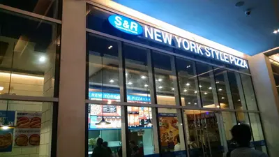 a new york supreme sign on the front of a store at 3N Palm Tree Villas in Manila