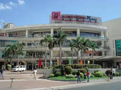 a building with people standing in front of it at Baywatch Tower in Manila