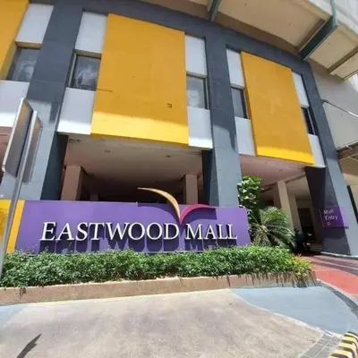 a building with a sign that reads eastwood mall at Eastwood Residence Above Eastwood Mall in Manila