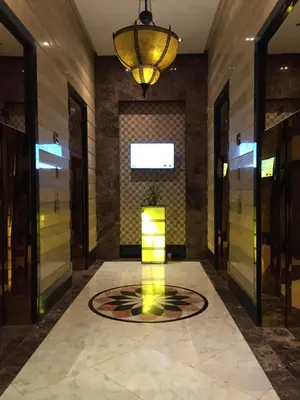 a lobby with a light in the middle of a room at Eastwood Residence Above Eastwood Mall in Manila