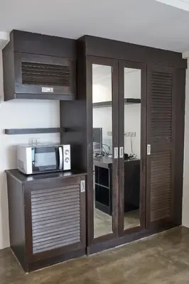 a room with sliding glass doors and a desk at 5880 Enriquez Residences in Manila