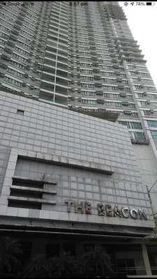 a large building with a sign on the side of it at Affordable Makati Serviced Apartments in Manila