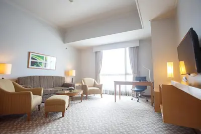 a living room with a couch and a table at The Linden Suites in Manila