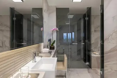 a bathroom with a sink and a shower at Manila Marriott Hotel at Newport World Resorts in Manila