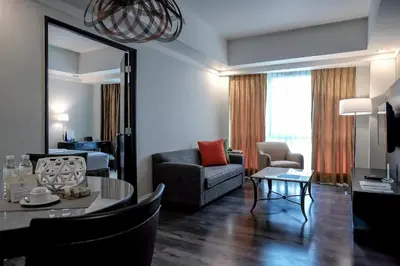 a living room with a couch and a table at Somerset Millennium Makati in Manila